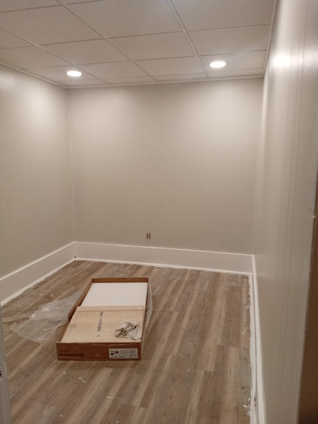 Interior painting project with masked floors and finishes